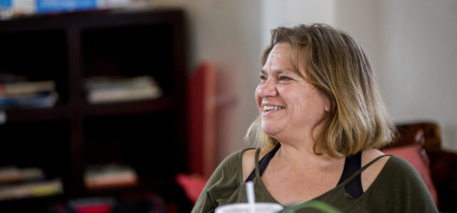 A homeless woman in Oklahoma City smiles from the care she is given. at Sanctuary